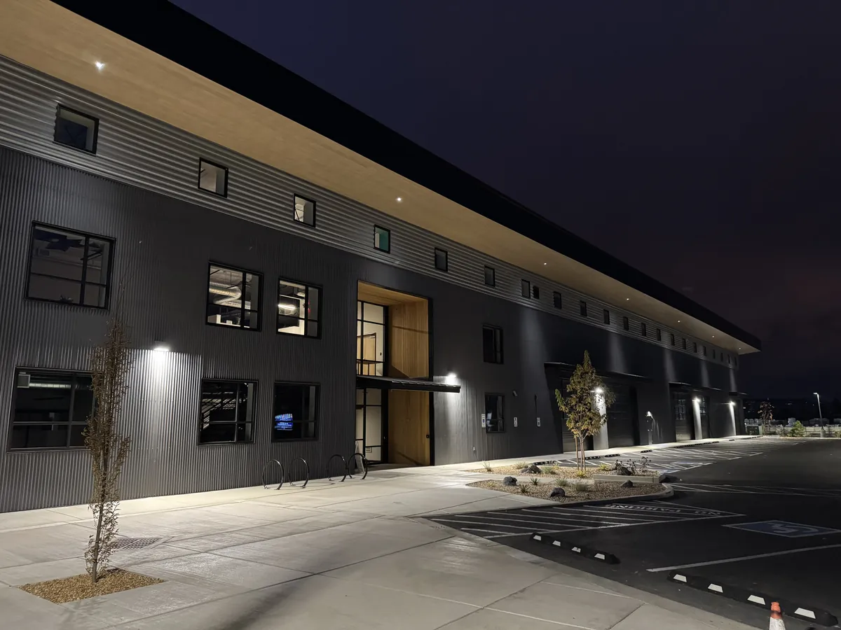 Long two-story commercial building lit at night