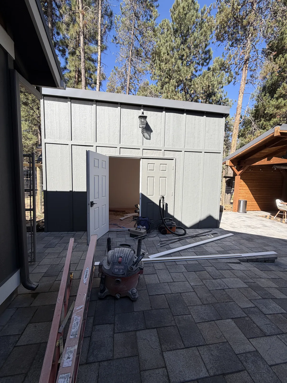 Finished outbuilding with new siding and door