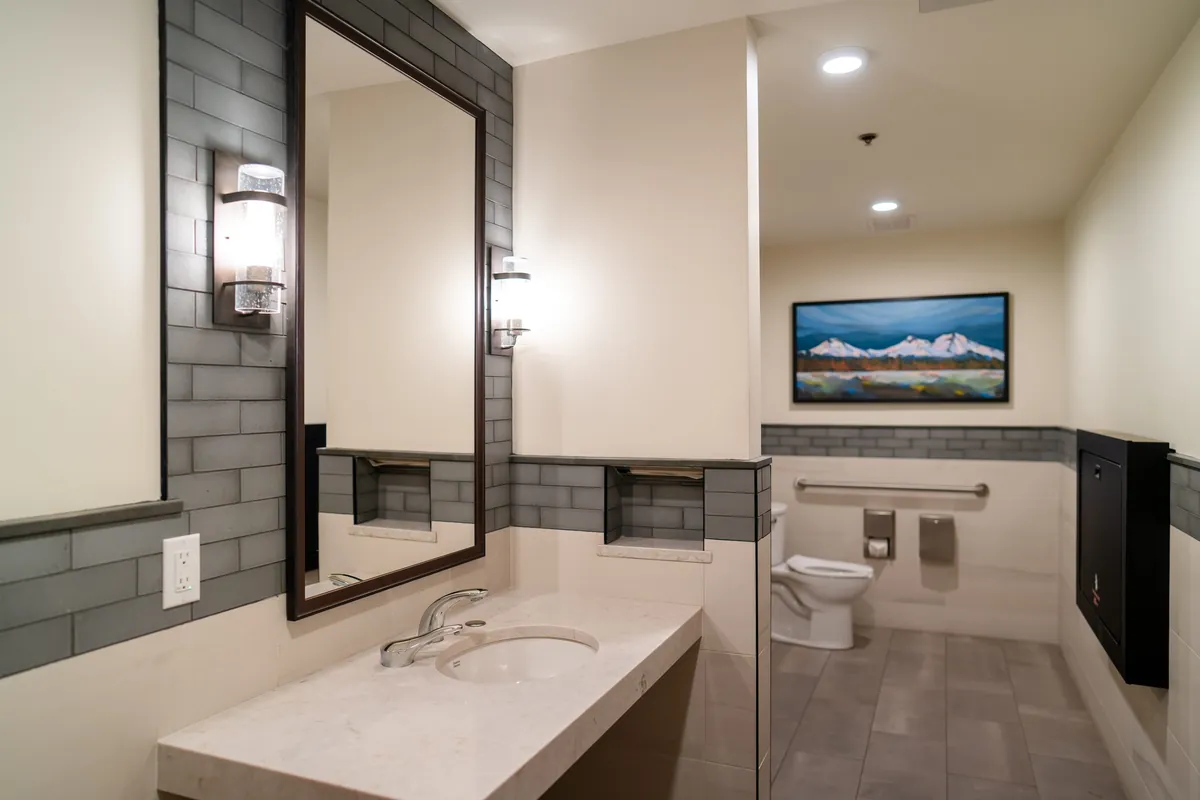 Lodge restroom after the remodel — new tile, mirror and vanity